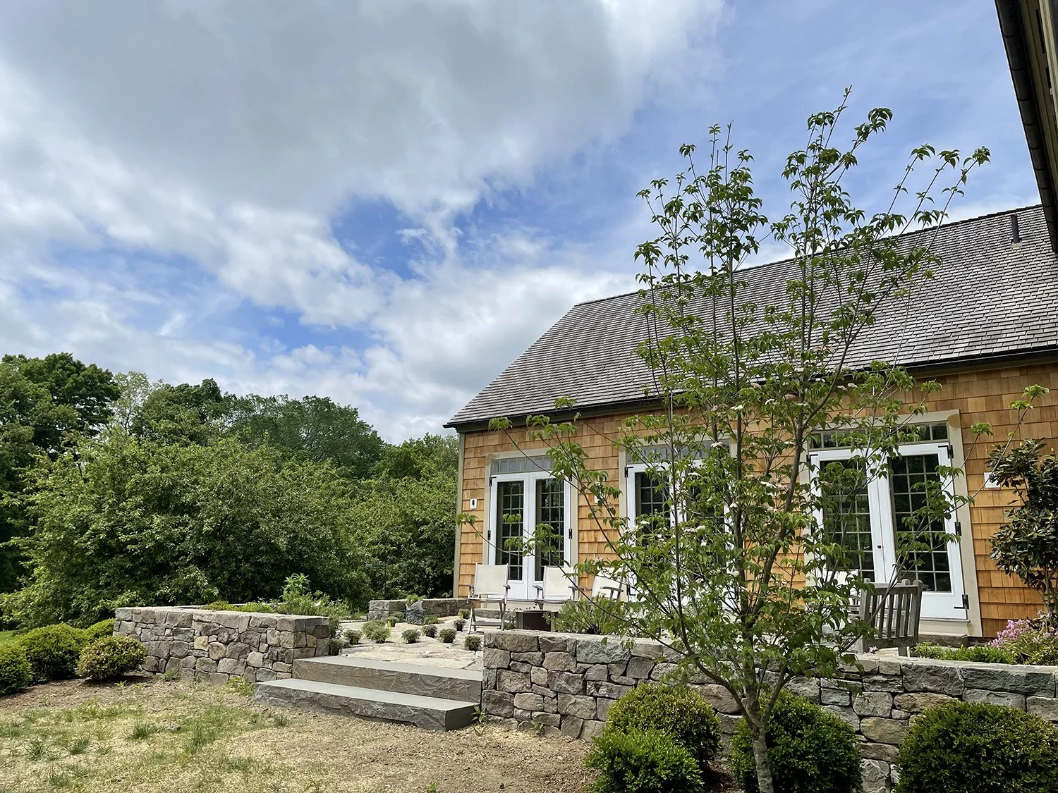 New stone terrace and low retaining walls beside the barn, Country Home, Redding CT