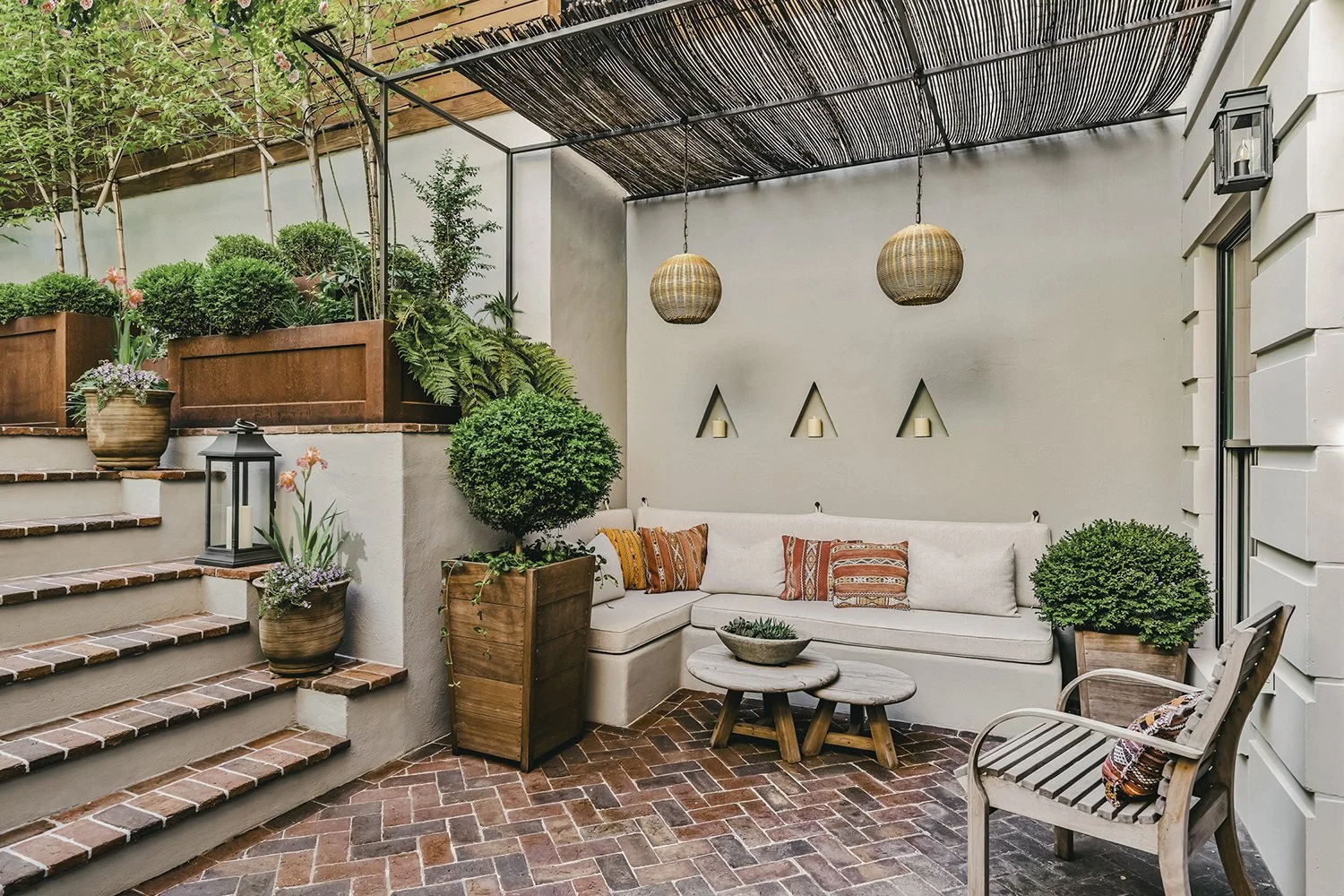 Built-in bench and lanterns beneath the willow-covered pergola, Townhouse Garden, Brooklyn