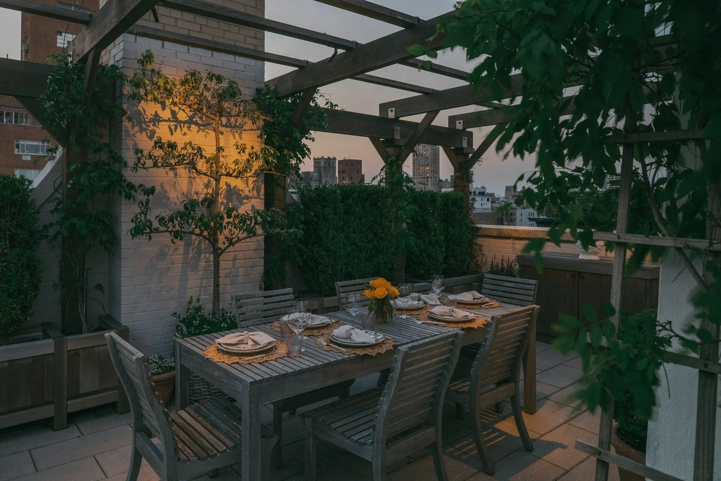 A perfect place to be.

A custom cedar pergola creates a sense of privacy and intimacy around the dining area, while still framing beautiful views across the New York skyline. Wisteria and Clematis are beginning to climb, laying the foundations for a