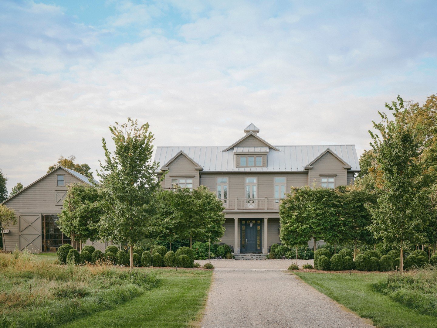 One of the biggest changes we made on this property was rethinking the driveway.

The original route approached the old farmhouse, the owners&rsquo; former home before they built the new house. We created a more graceful approach to the new property,
