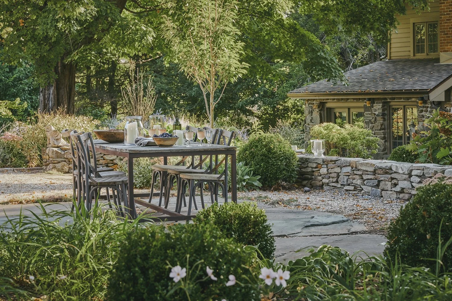 Dining terrace with dry-stacked stone walls and a garden pavilion, Hudson Valley Estate, Rhinebeck