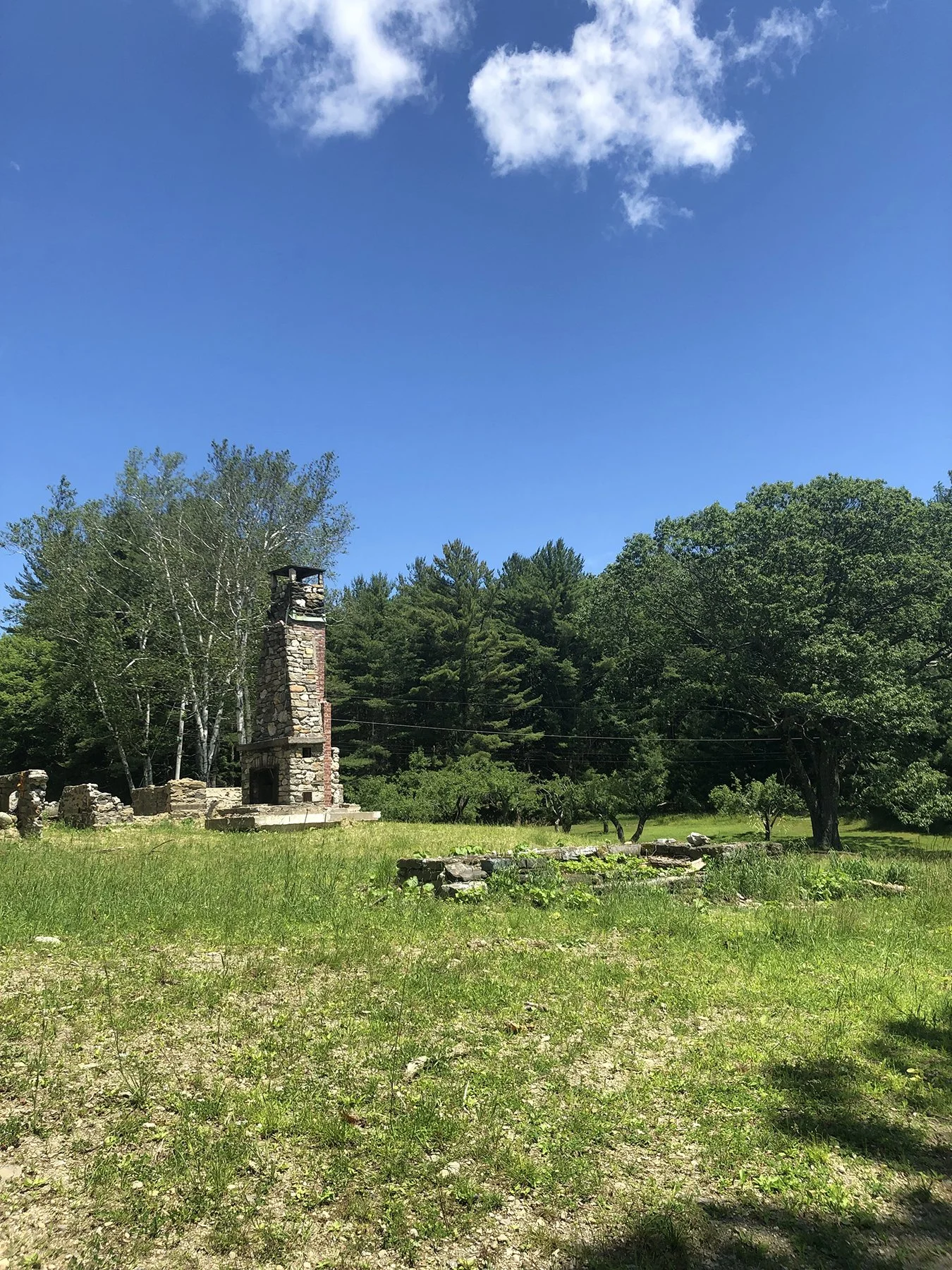 Old stone chimney standing in the meadow, Mountain Retreat, Mt Washington MA