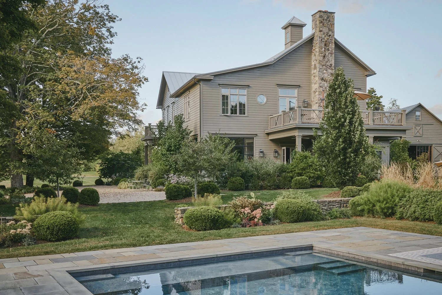 Swimming pool and planted terraces beside the house, Hudson Valley Estate, Rhinebeck