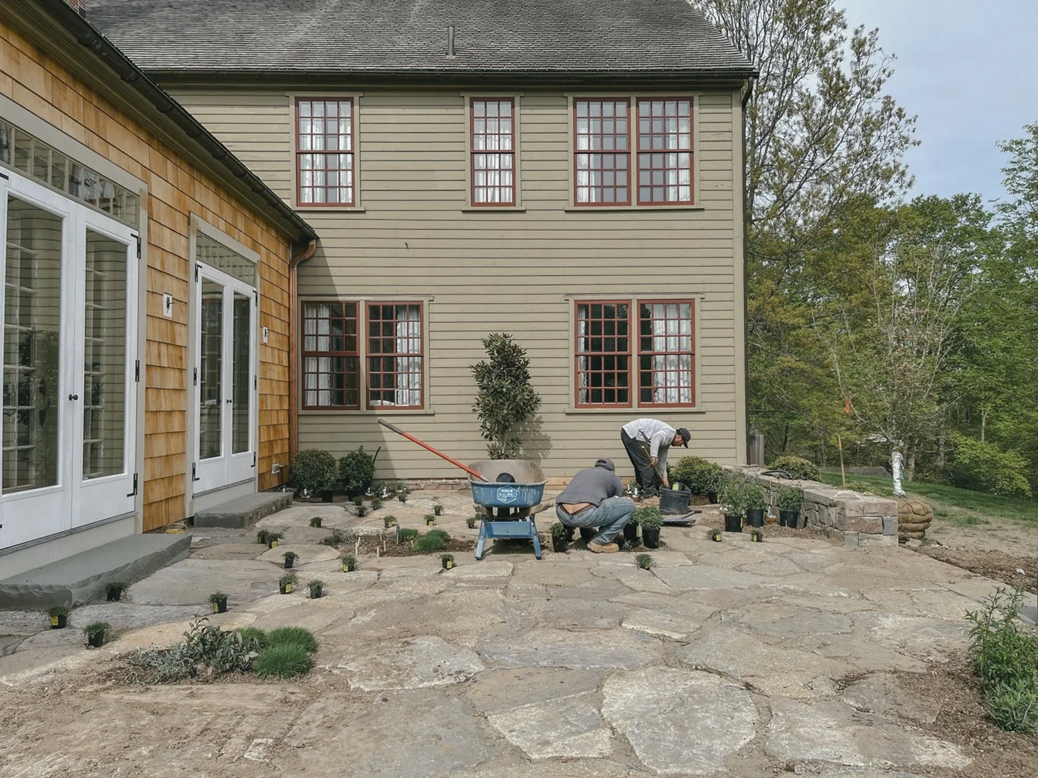 Natural stone paving being laid on the barn terrace, Country Home, Redding CT