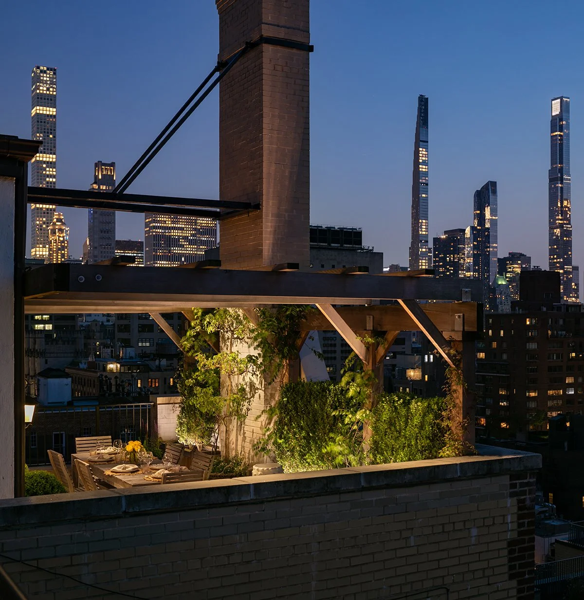 Pergola lit at night against the Midtown skyline, Upper East Side Penthouse