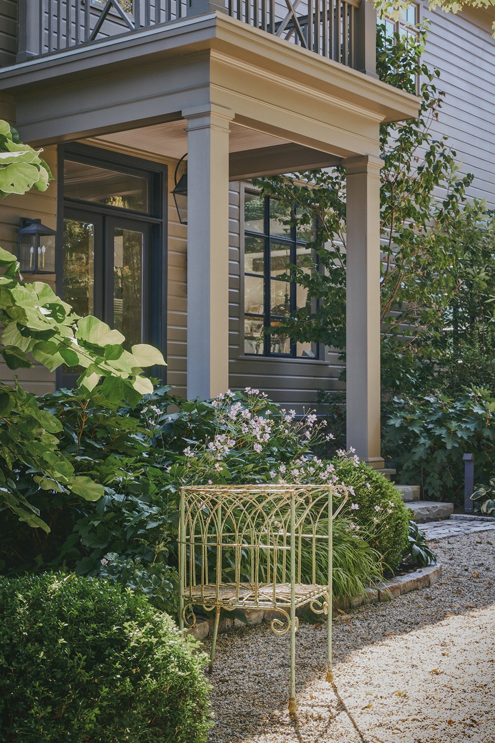 Garden chair among perennials beneath the porch, Hudson Valley Estate, Rhinebeck