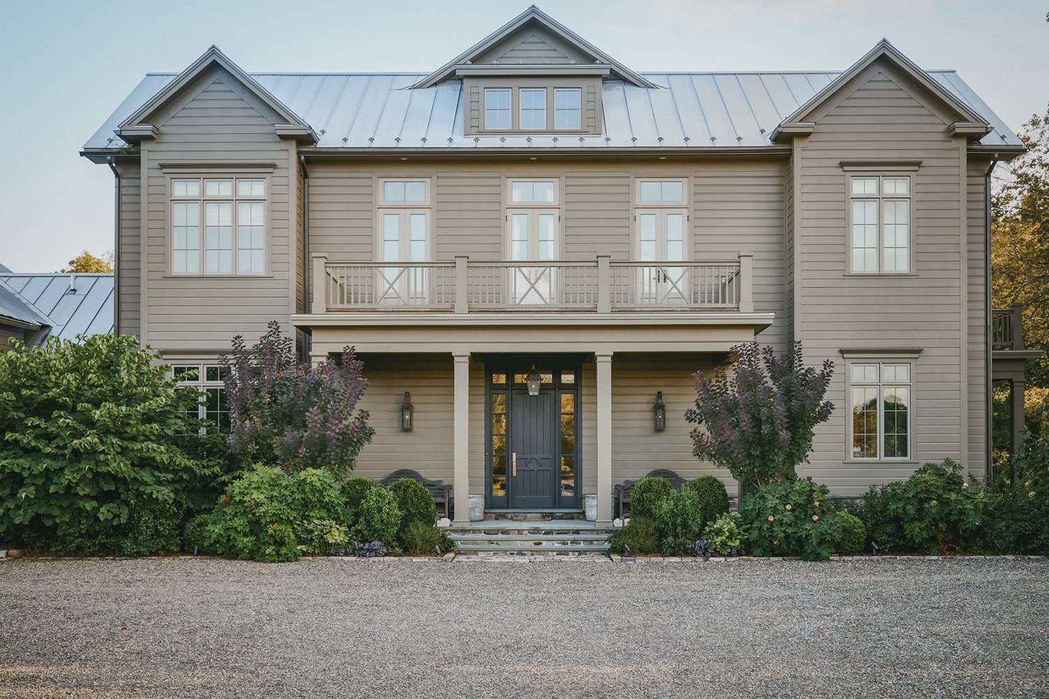 Front of the house with layered planting along the gravel forecourt, Hudson Valley Estate, Rhinebeck