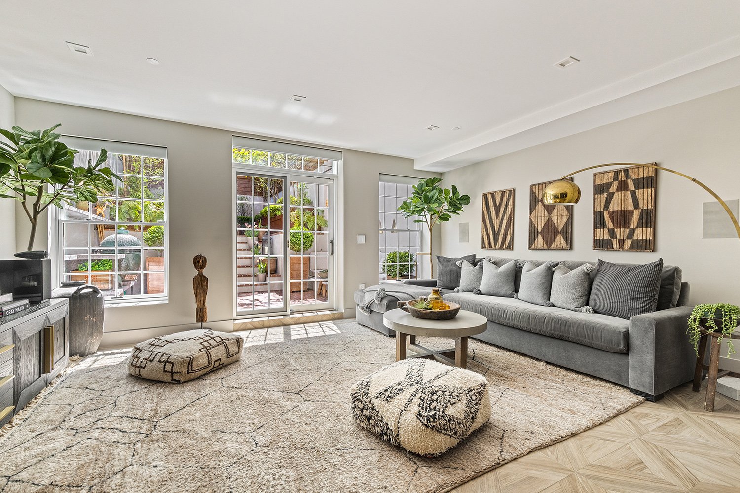 Living room opening onto the garden through tall glazed doors, Townhouse Garden, Brooklyn