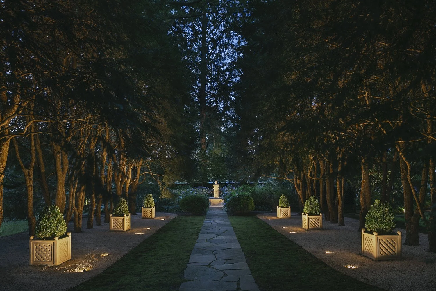 Garden axis of lit planters leading to the fountain at night, Historic Garden, Shrewsbury NJ