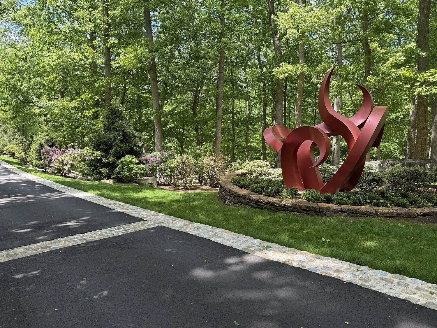 Red sculpture beside the drive at the edge of the woodland, Riverfront Estate, Navesink River
