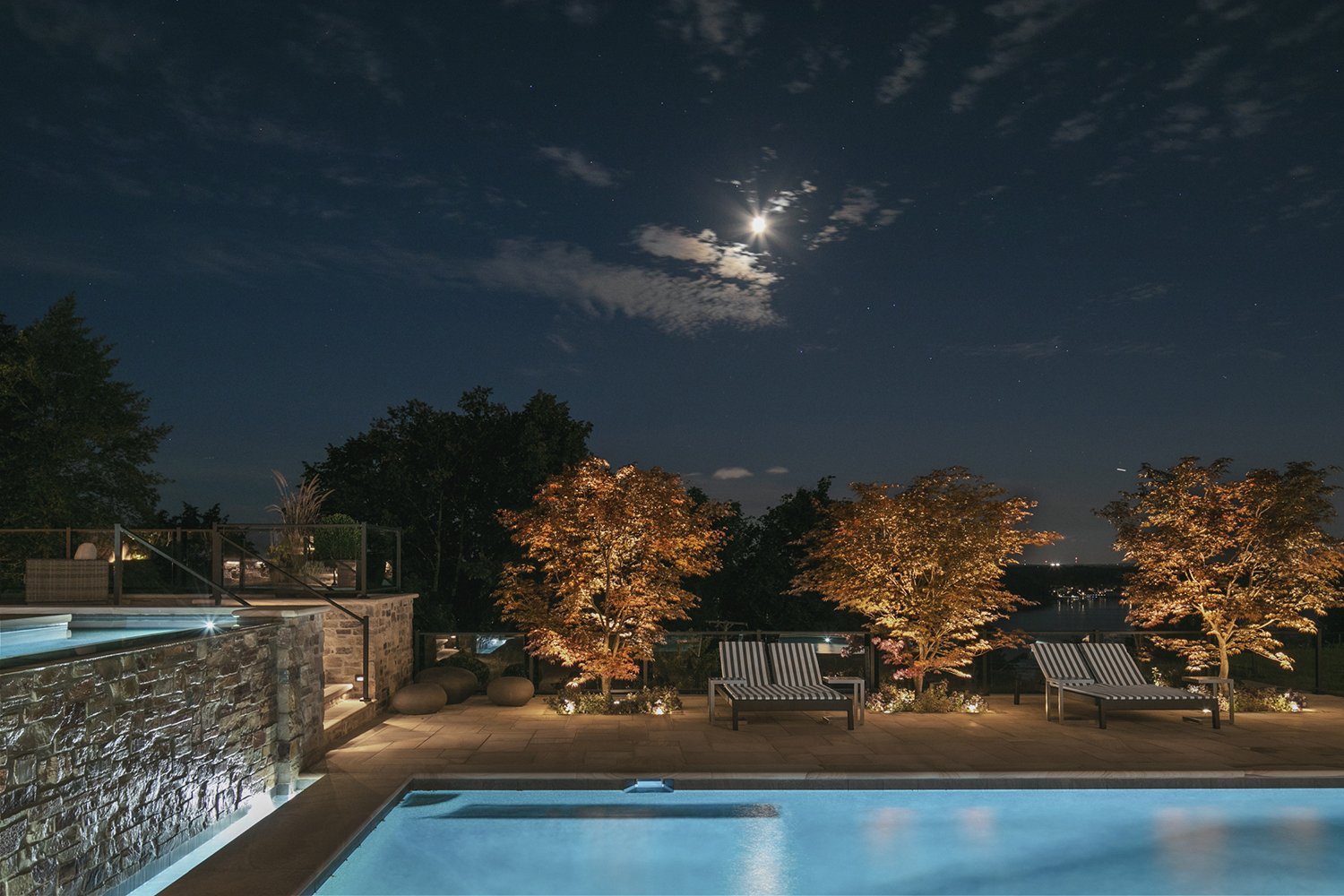 Pool and Japanese maples lit beneath a night sky, Riverfront Estate, Navesink River