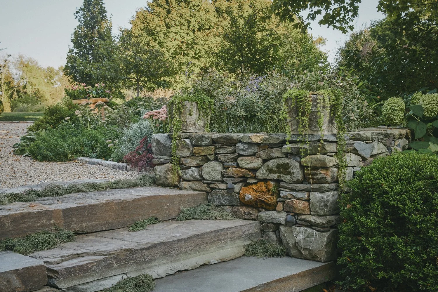 Stone steps and dry-stacked walls through the gravel garden, Hudson Valley Estate, Rhinebeck