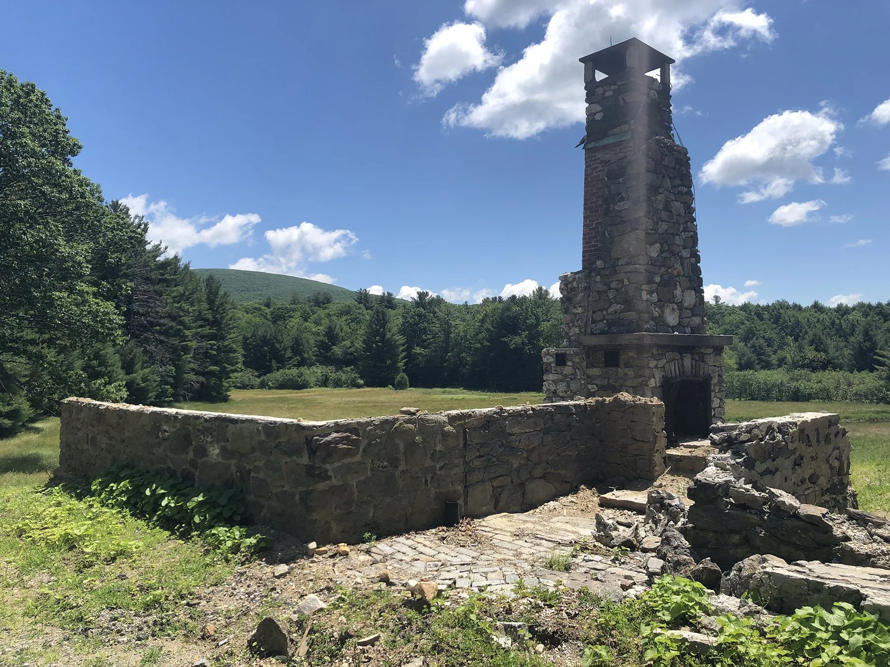 Stone ruin and chimney set within the meadow, Mountain Retreat, Mt Washington MA
