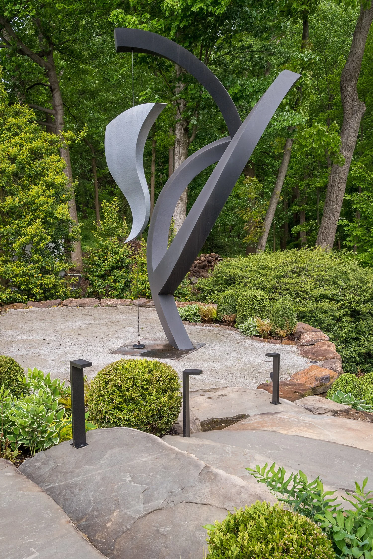 Abstract metal sculpture on a stone terrace, Riverfront Estate, Navesink River