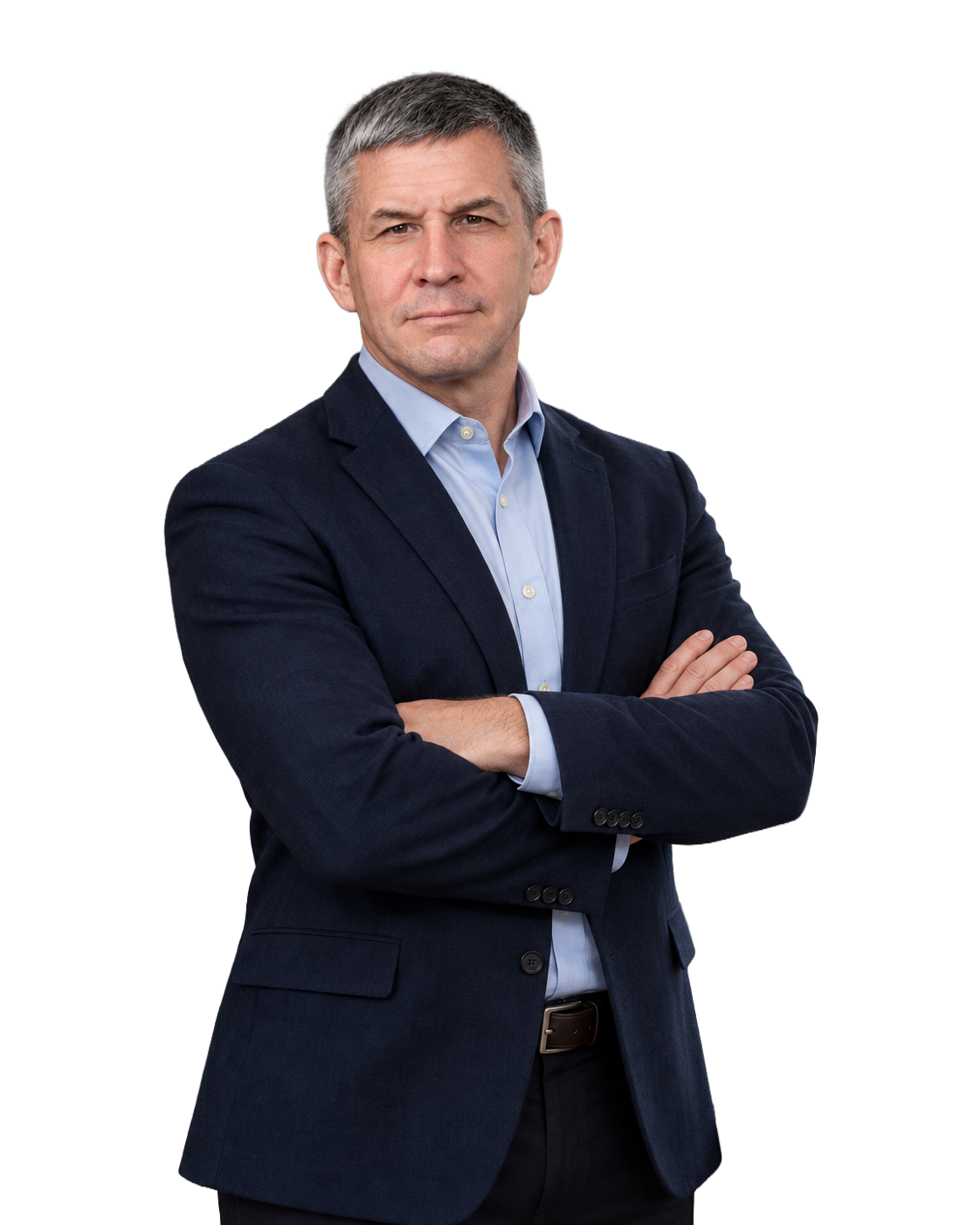 A middle-aged man with gray hair, wearing a navy blazer and light blue shirt, standing with arms crossed against a plain background.