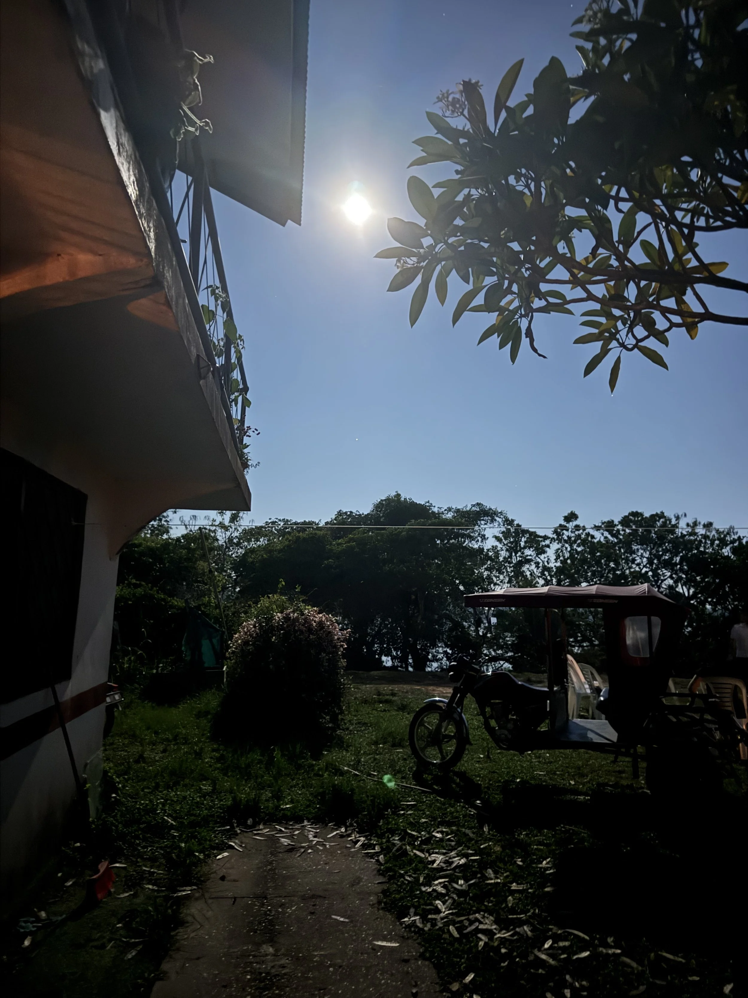 A beautiful moonlit look at a "moto car" parked next to a mission home in Pucallpa, Peru.