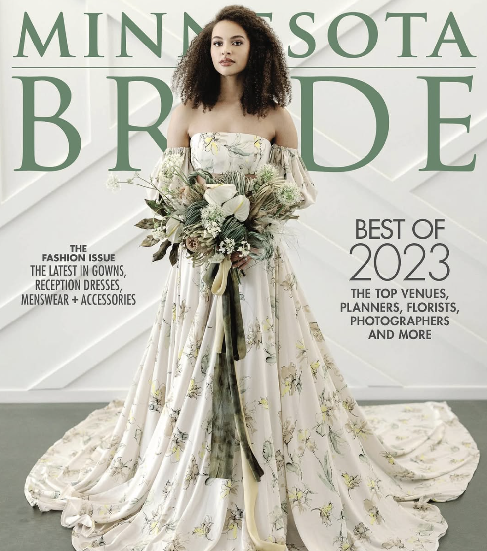 Cover of Minnesota Bride magazine featuring a woman in a floral wedding gown holding a bouquet of flowers, with large green text reading "Minnesota Bride" and additional text about wedding trends and experts in 2023.