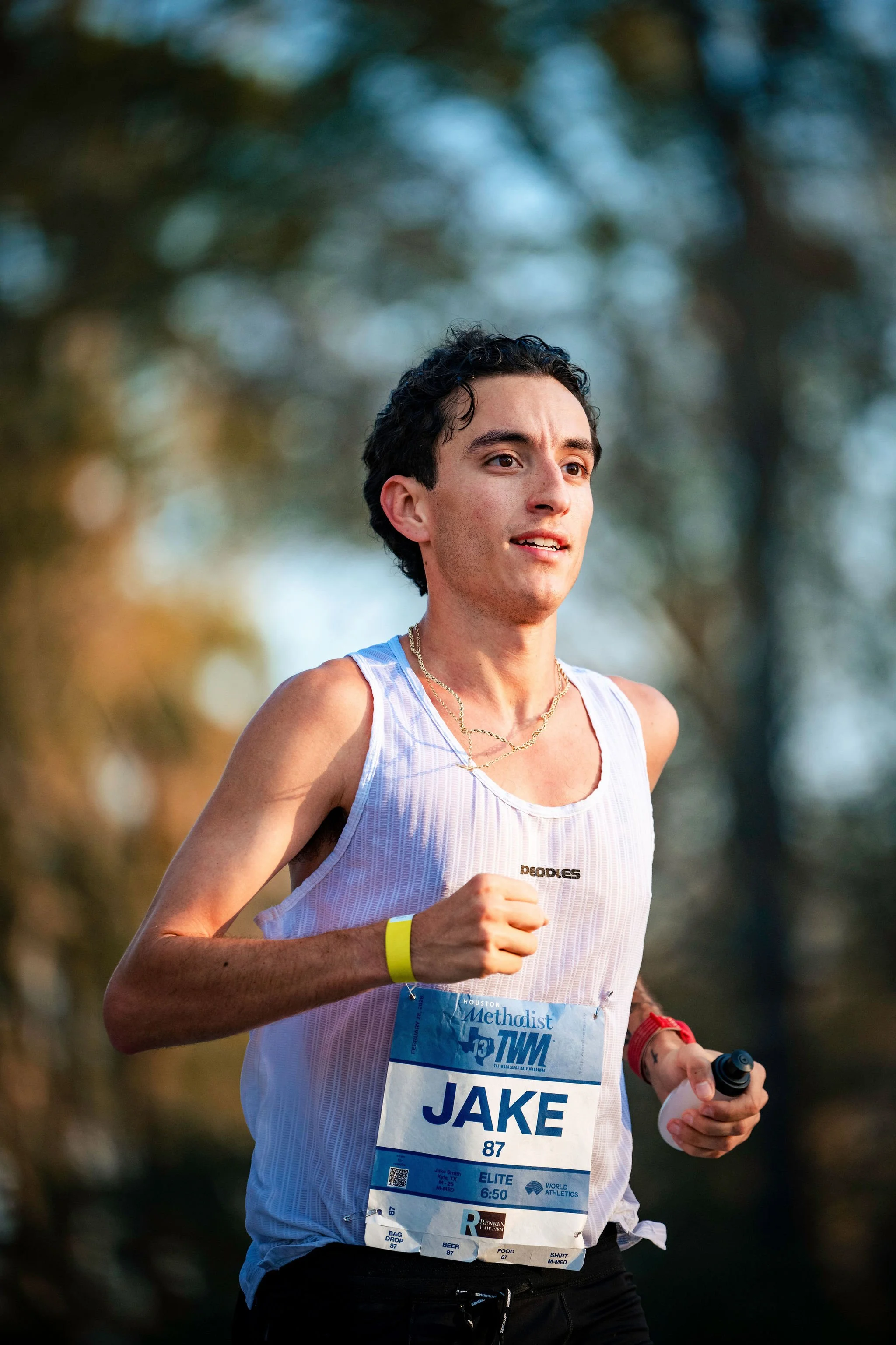 A Woodlands Marathon athlete running toward the finish
