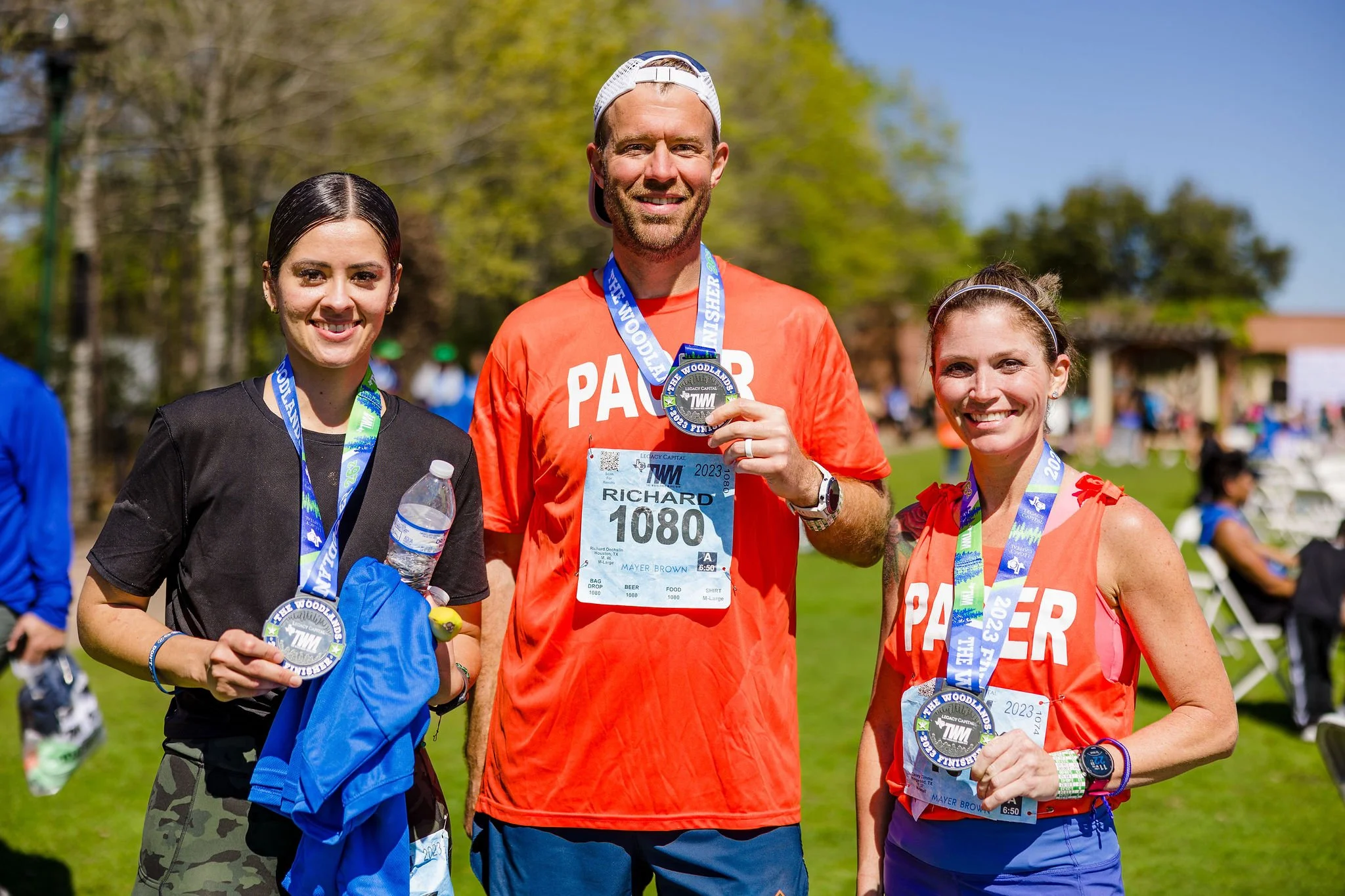 Finishers displaying their medals after the race