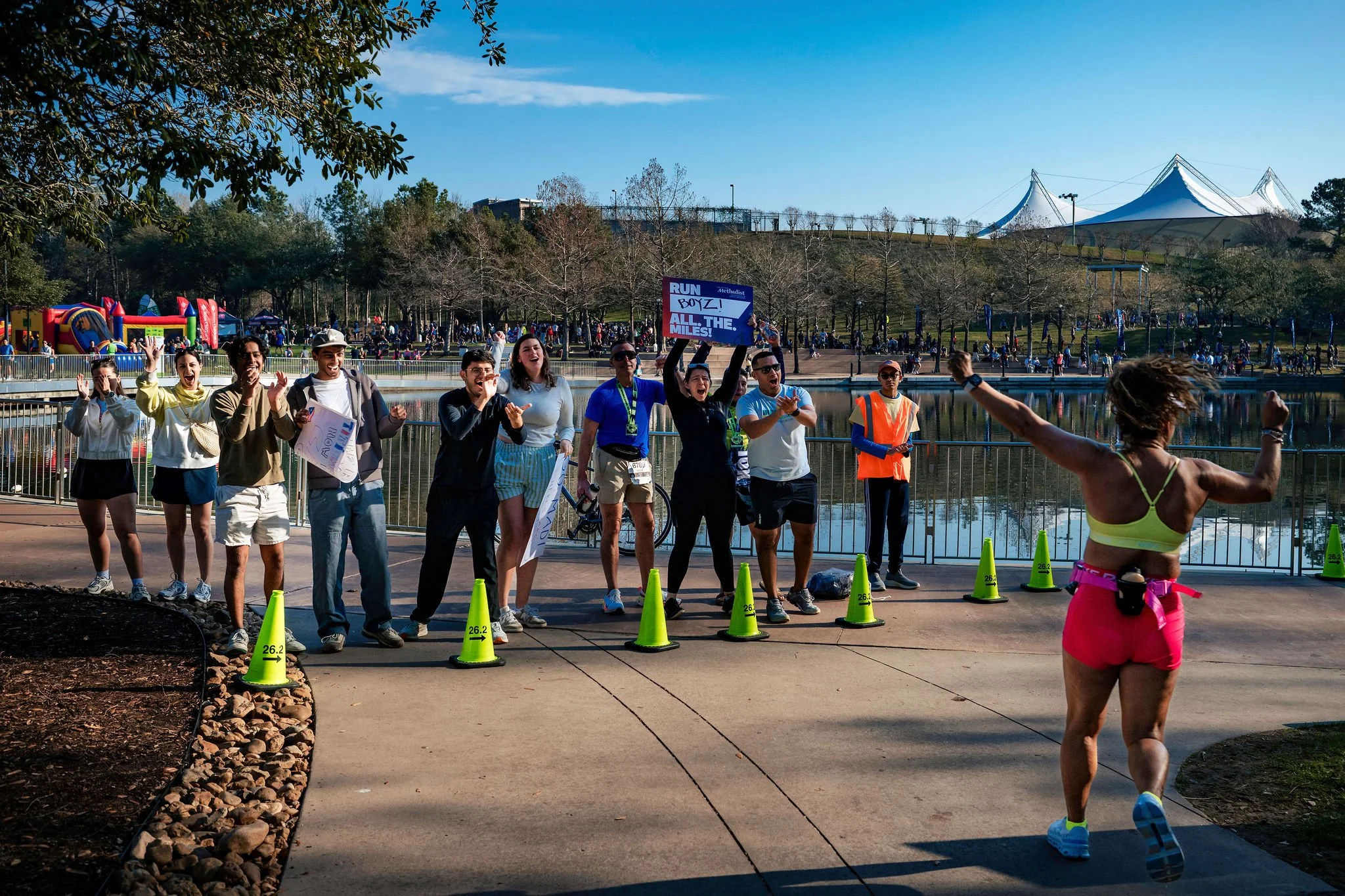 Athletes racing together through The Woodlands