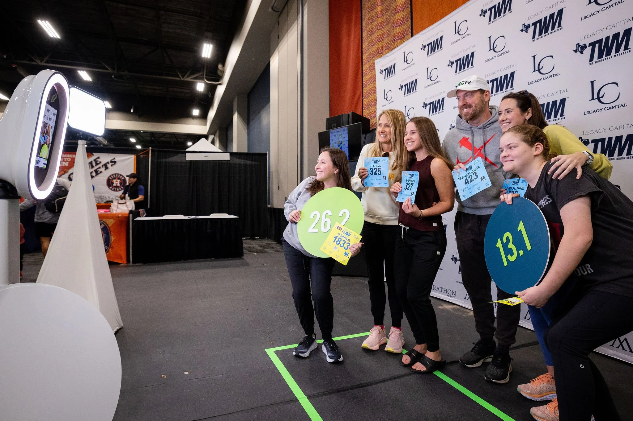 Runners using the Expo photo activation inside the vendor hall
