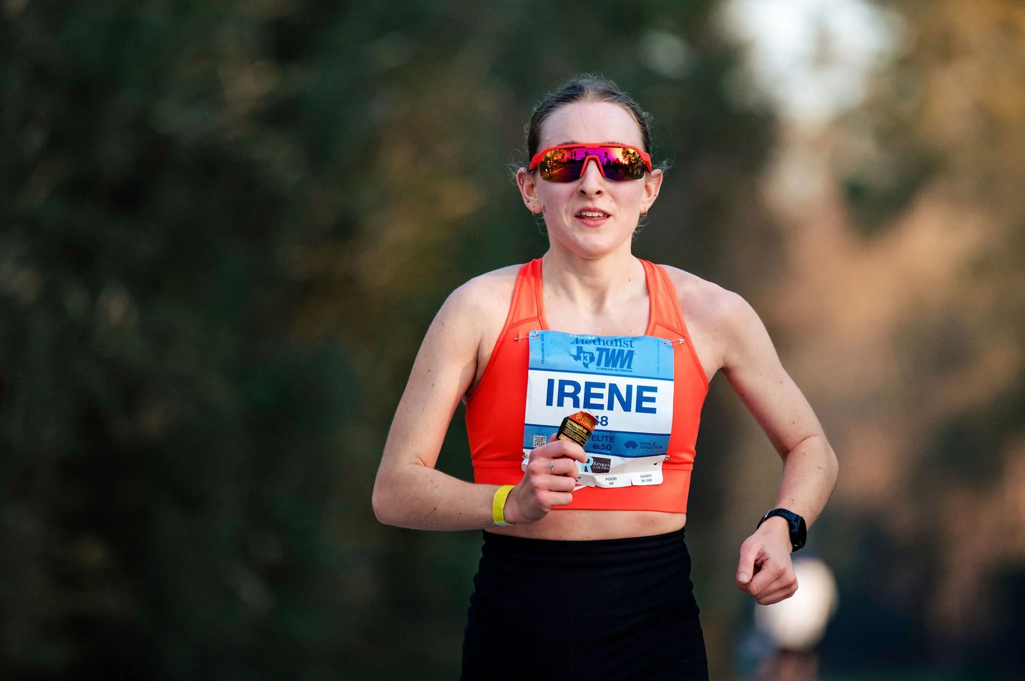 An elite marathon runner racing toward the finish