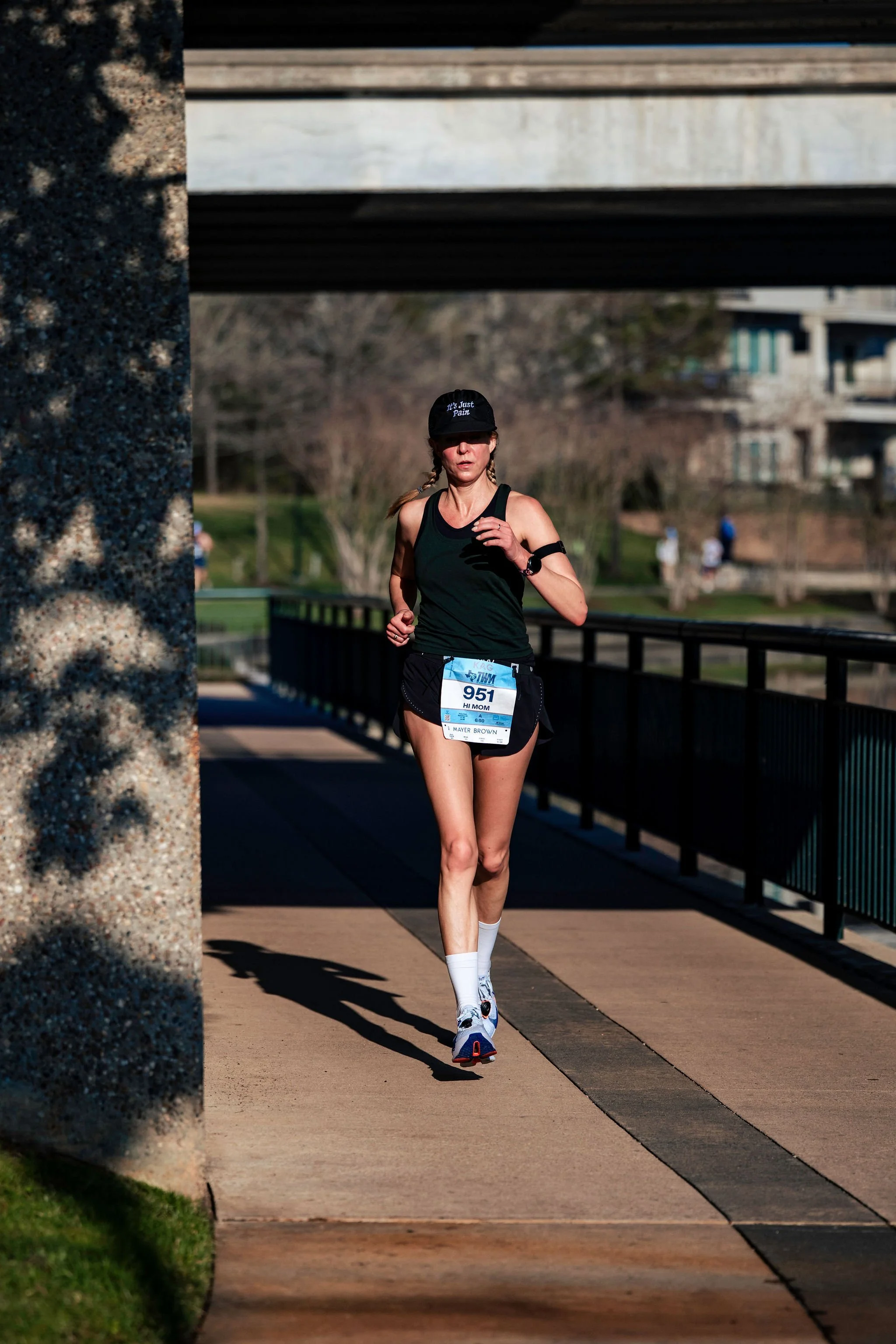 A runner completing her race independently along The Woodlands Waterway
