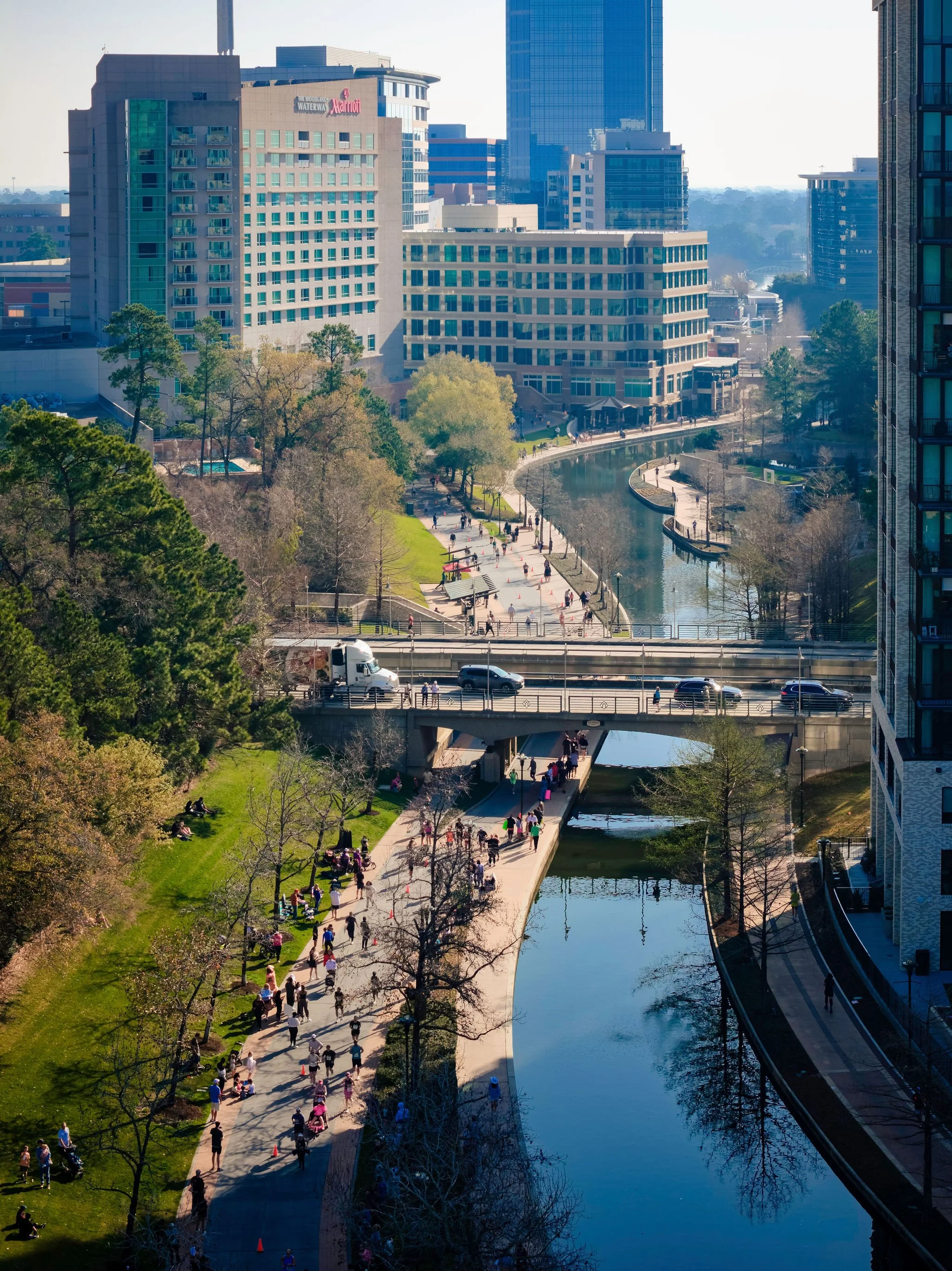 Runners on The Woodlands course beside the Waterway