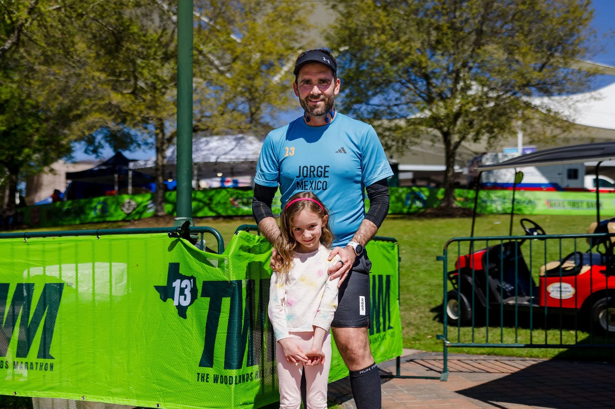 A Woodlands Marathon finisher celebrating with family