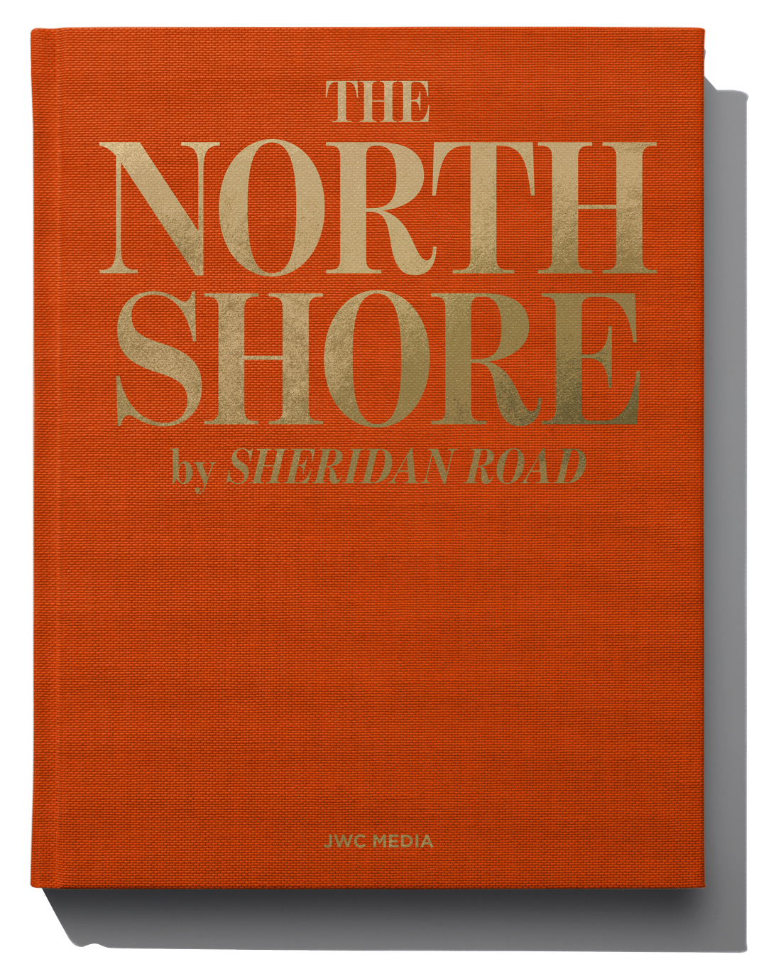 Close-up of a book titled 'The North Shore by Sheridan Road,' published by JWC Media with an orange linen hard-cover and gold foil stamping.
