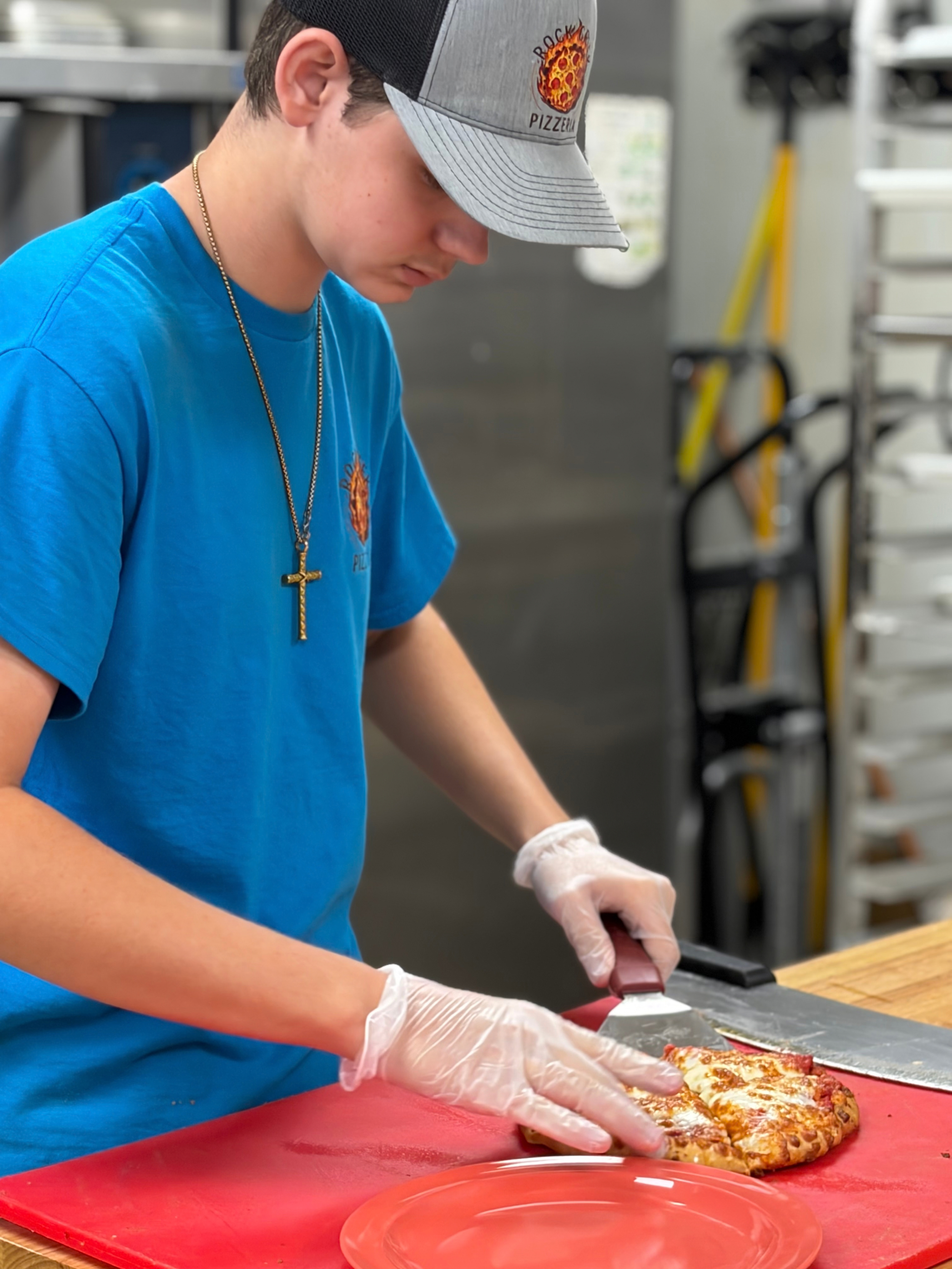 Team Member Making Pizza - Rock Creek Pizzeria (1).png