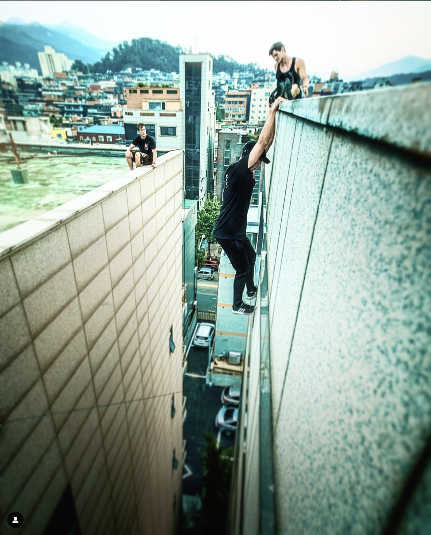 Max from Storror checking a wall grip before filming Roof Culture Asia