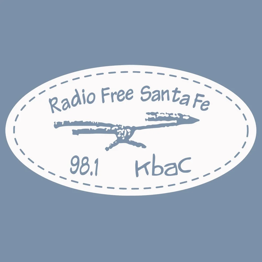 Radio Free Santa Fe logo with a bird illustration and frequency 98.1 Kbac on a blue background.