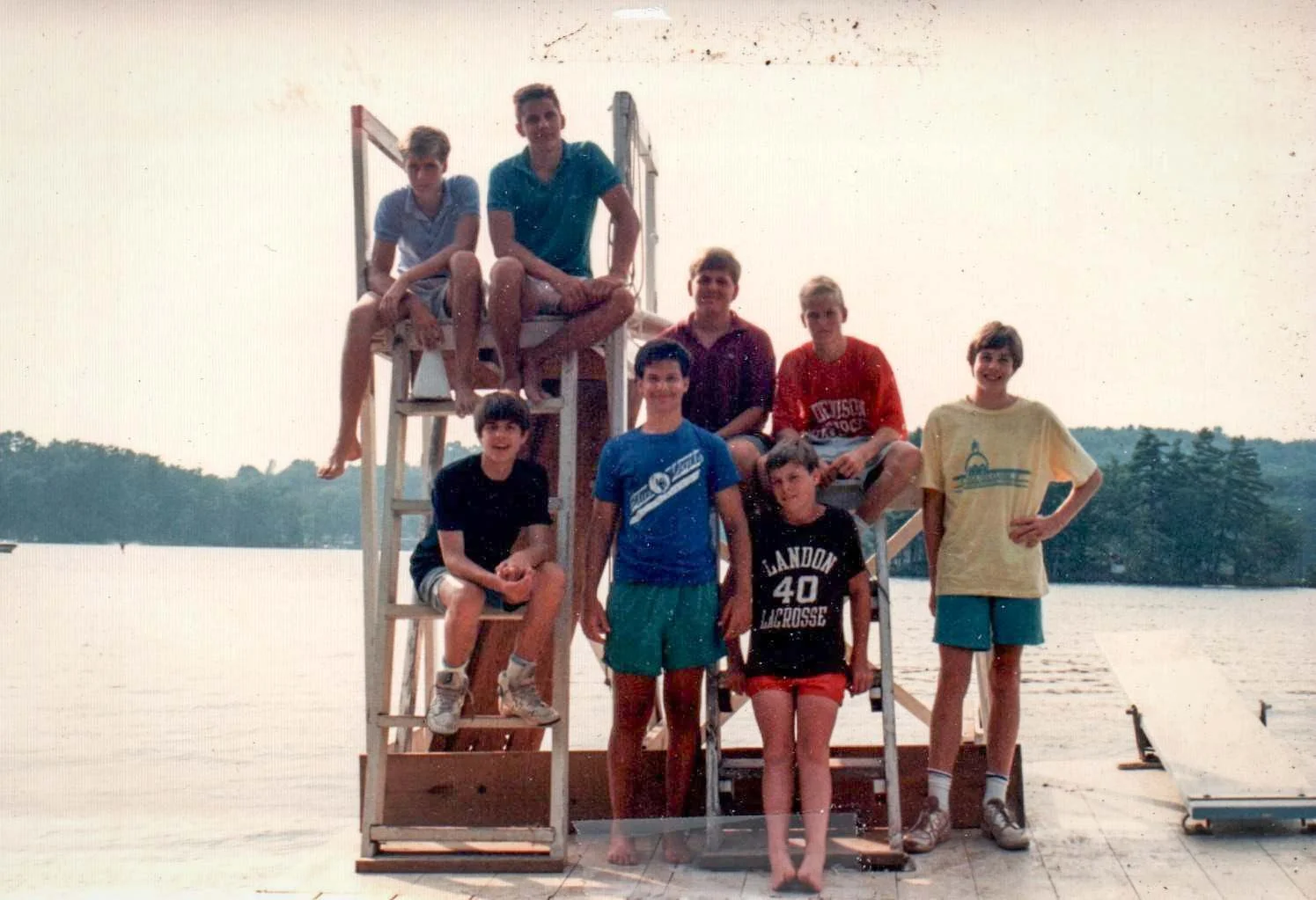 Group of campers and counselors gathering on the dock in the 1980s
