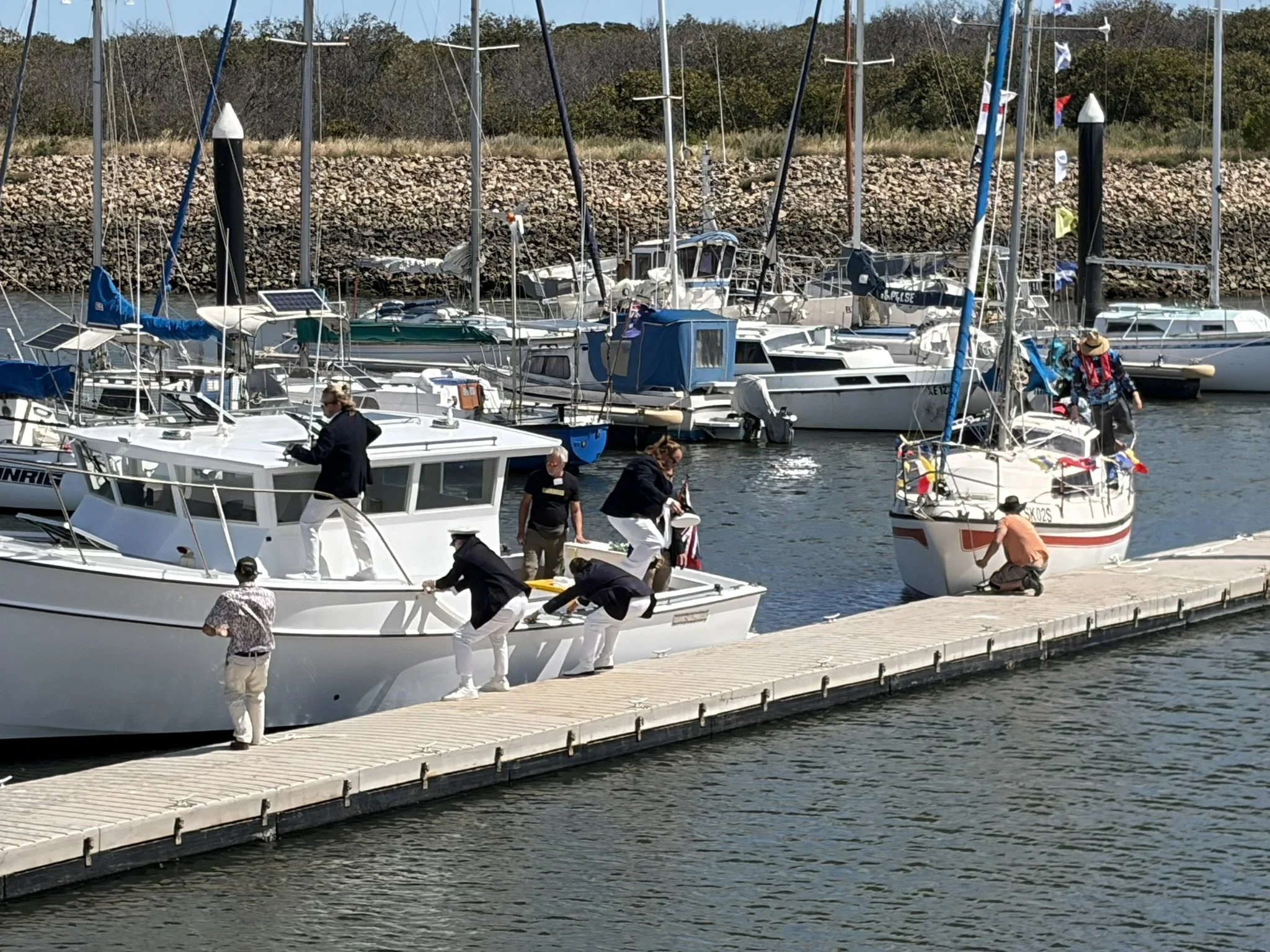 The official boat "Duchess" and her guests assist one of our sail past participants towed back after a motor mishap....
