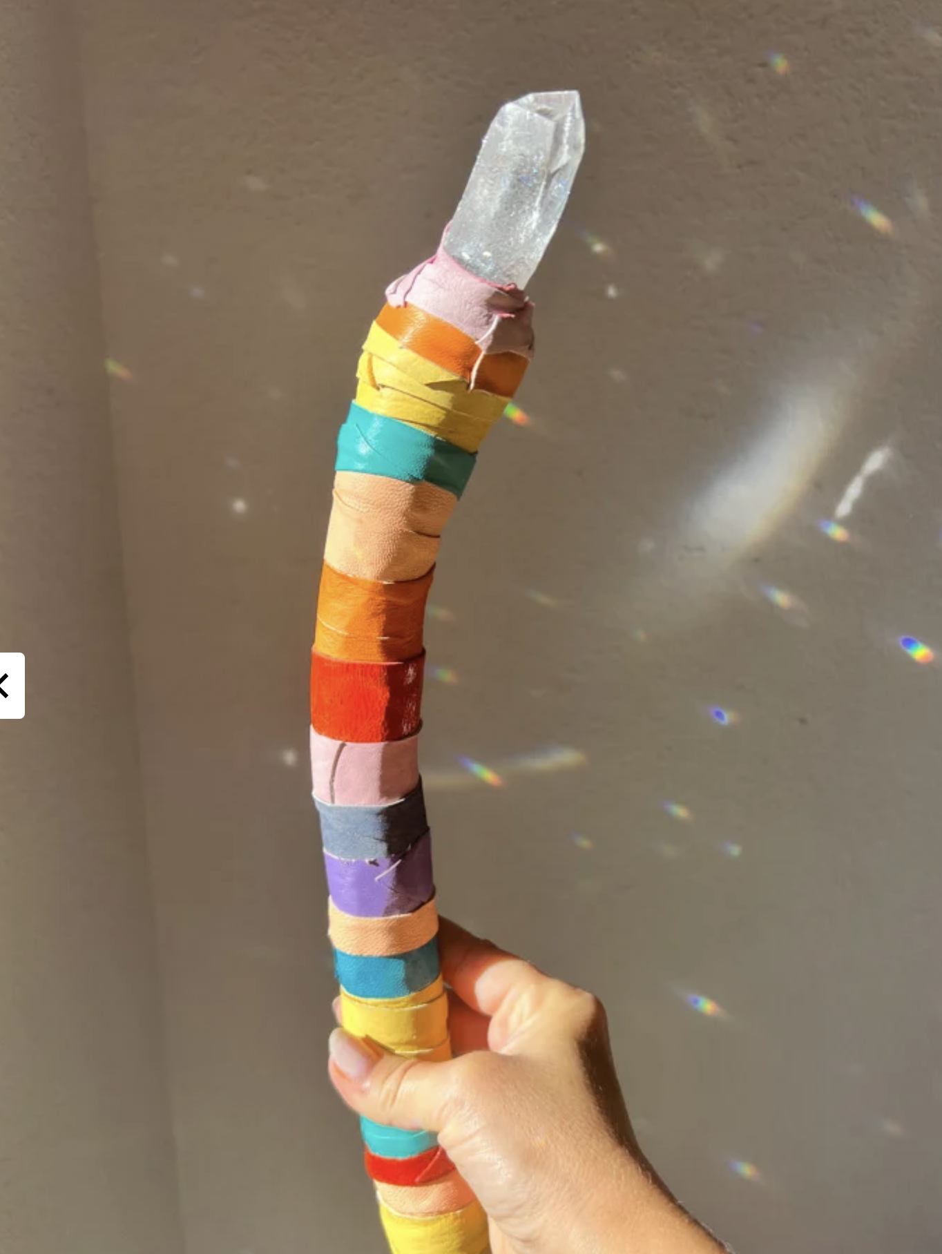 Super Happy CURVED Rainbow crystal wand. A huge, Colombian Lemurian quartz tops this large-yet-lightweight magic wand.

Wand is 15" in length and wrapped in beautiful, repurposed Italian leathers.

*********
Handmade, one-of-a-kind MAGIC WAND. Natura