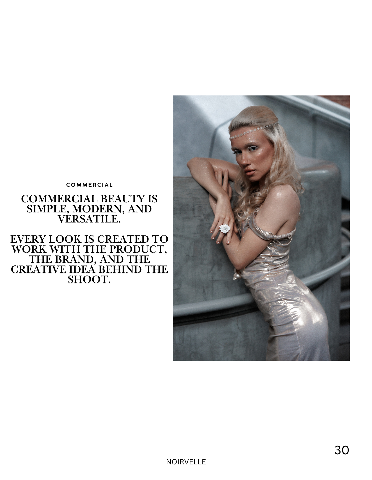 A woman with blonde curly hair and a pearl headband wearing a shiny beige dress sitting on concrete stairs, resting her arms on her knees and looking at the camera.