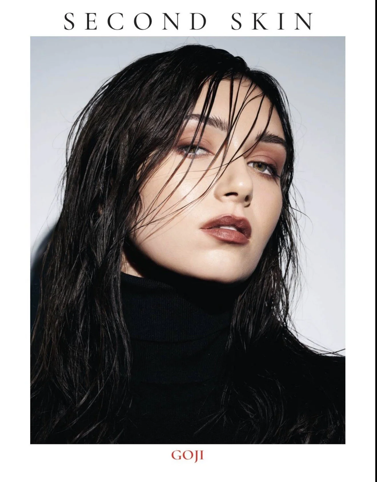 Noirvellel PUBLISHED in the “Second Skin” fashion MAGAZINE GOJI editorial, wearing a black turtleneck with wet-look hair.