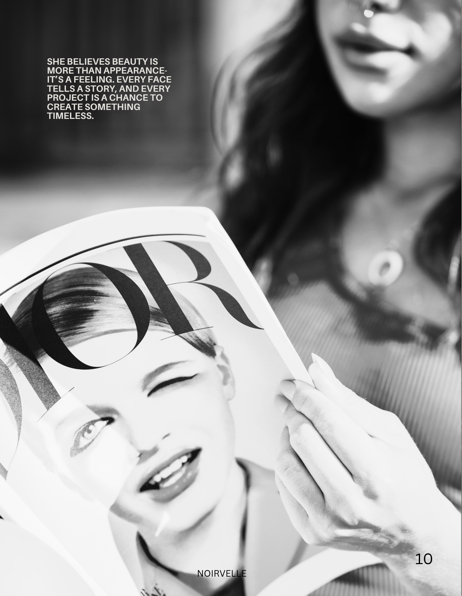 Close-up black-and-white photograph of a woman holding a magazine, with her face partially visible. The magazine features a woman's face with bold makeup. There is a quote on the left side about believing beauty being a feeling. The word 'NOIRVELLE' 