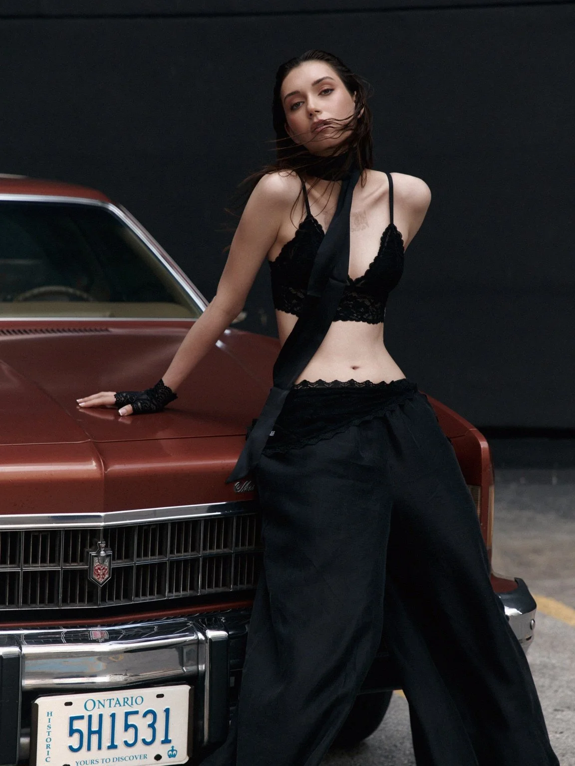 High fashion model posing with a vintage car in Toronto – Noirvellel
