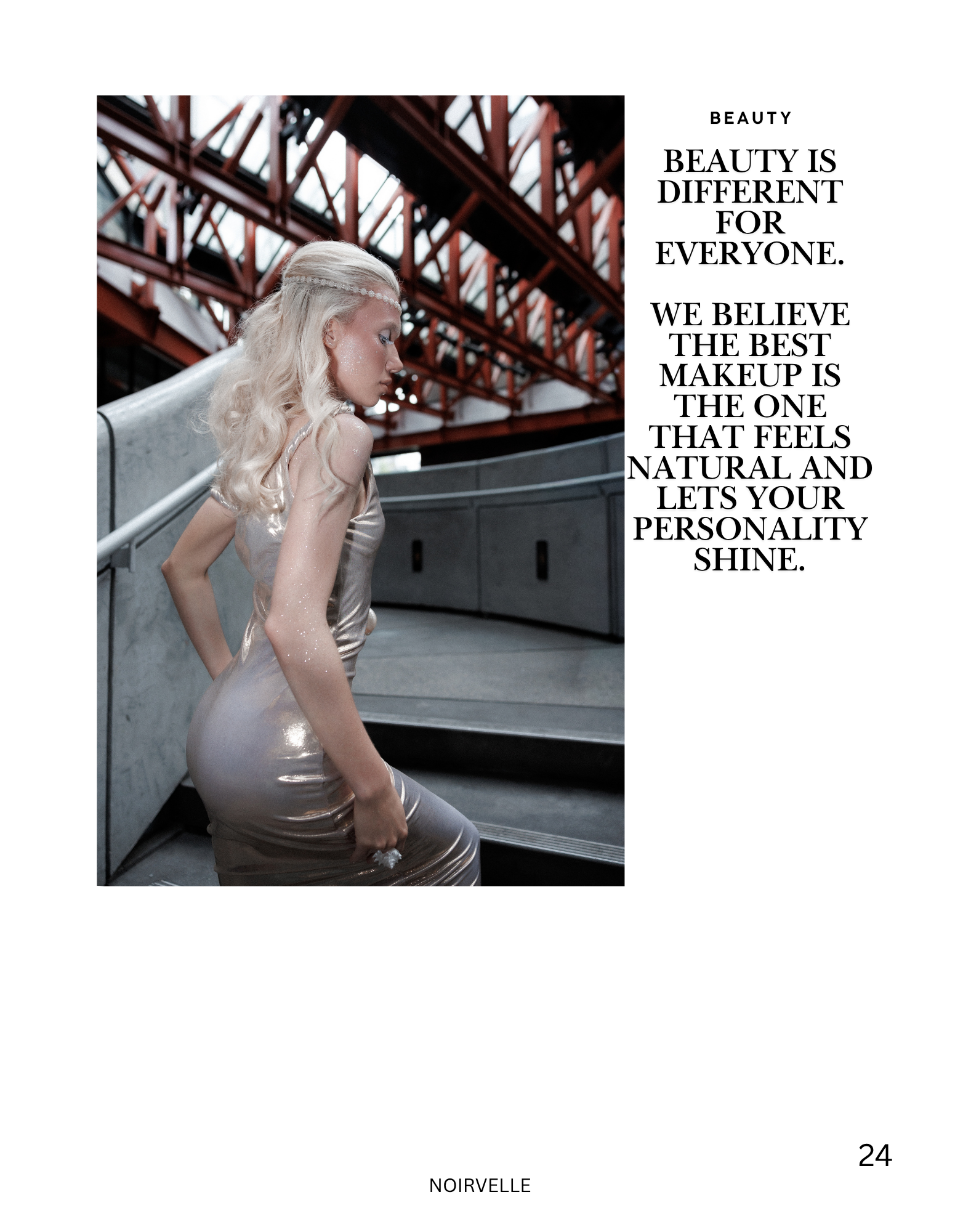 A woman with platinum blonde hair styled in loose rings is sitting on stairs made of metal. She is wearing a shiny, beige dress, and her makeup includes glitter on her face. The background shows an industrial-looking structure with metal beams and gl