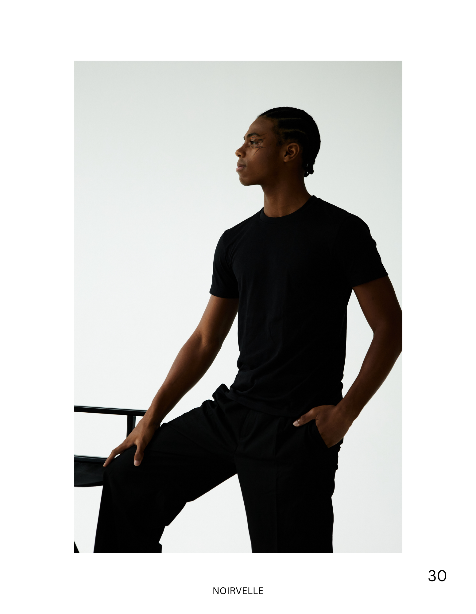 Minimalist studio fashion portrait of male model in black – Noirvellel