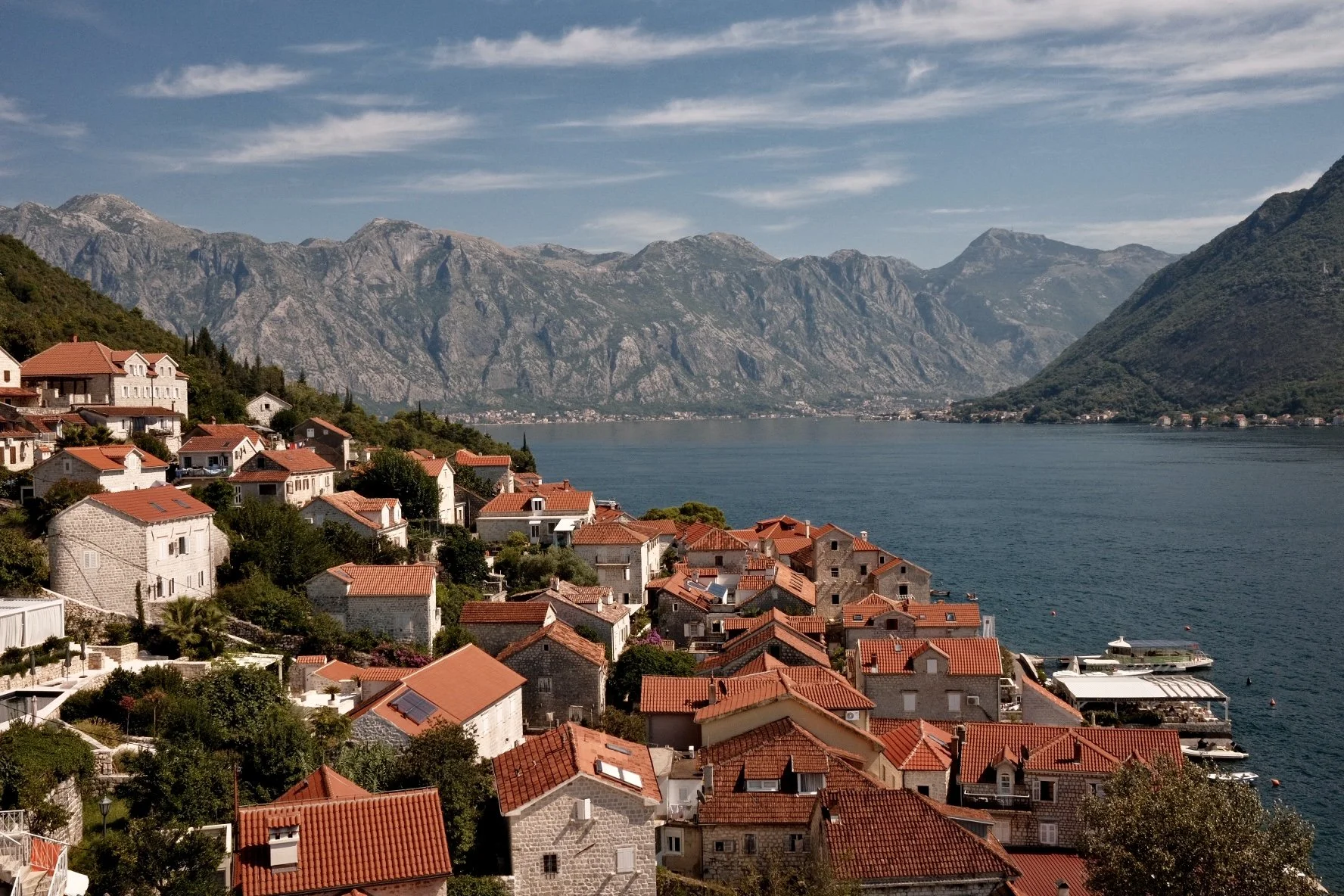 View of red roofs and mountains in Perast, Montenegro