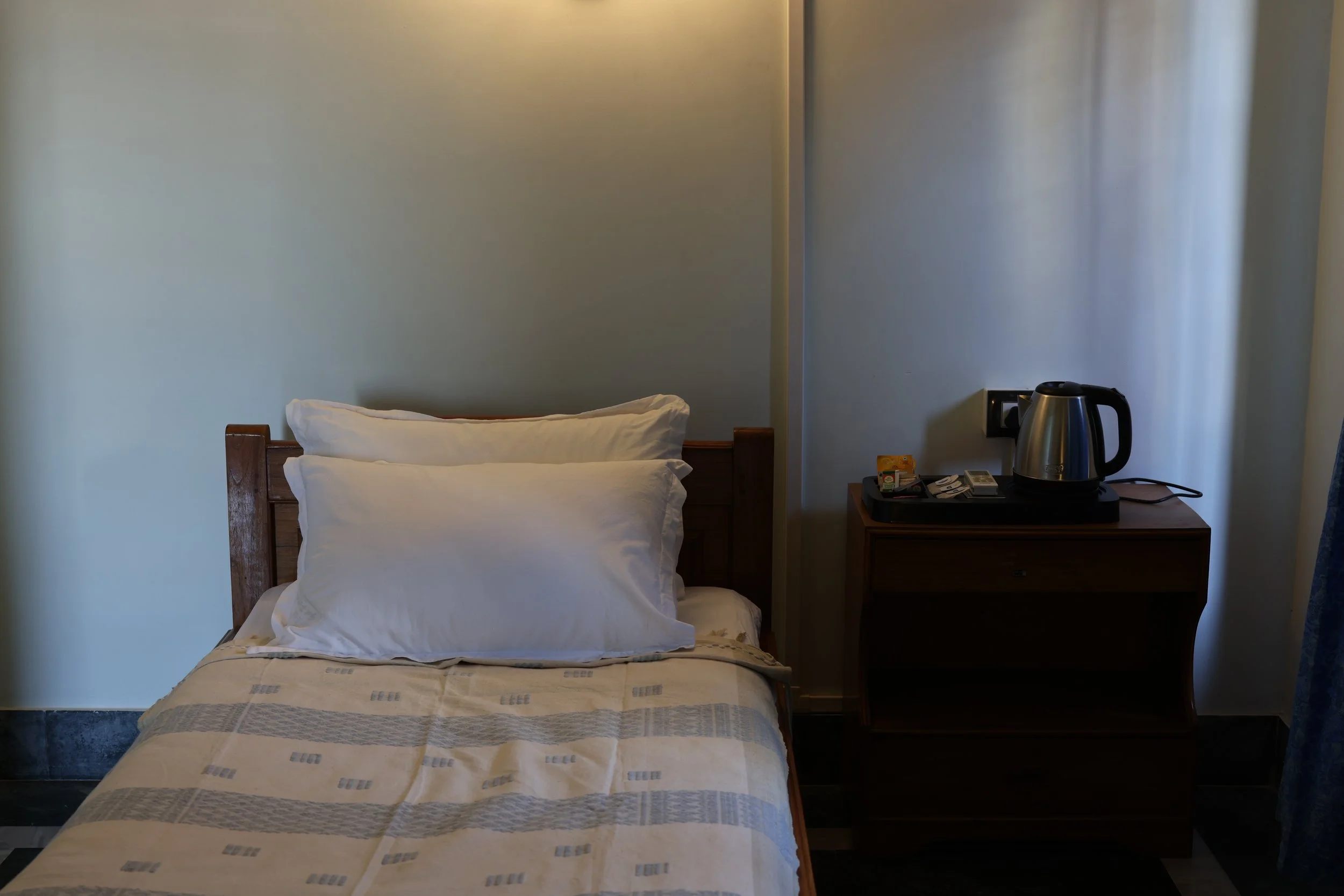 Single Room. A generously sized room with a comfortable single bed and a private attached bathroom. A welcoming choice for guests travelling on their own. Single occupancy only.

Price: ₹2,000 per night
