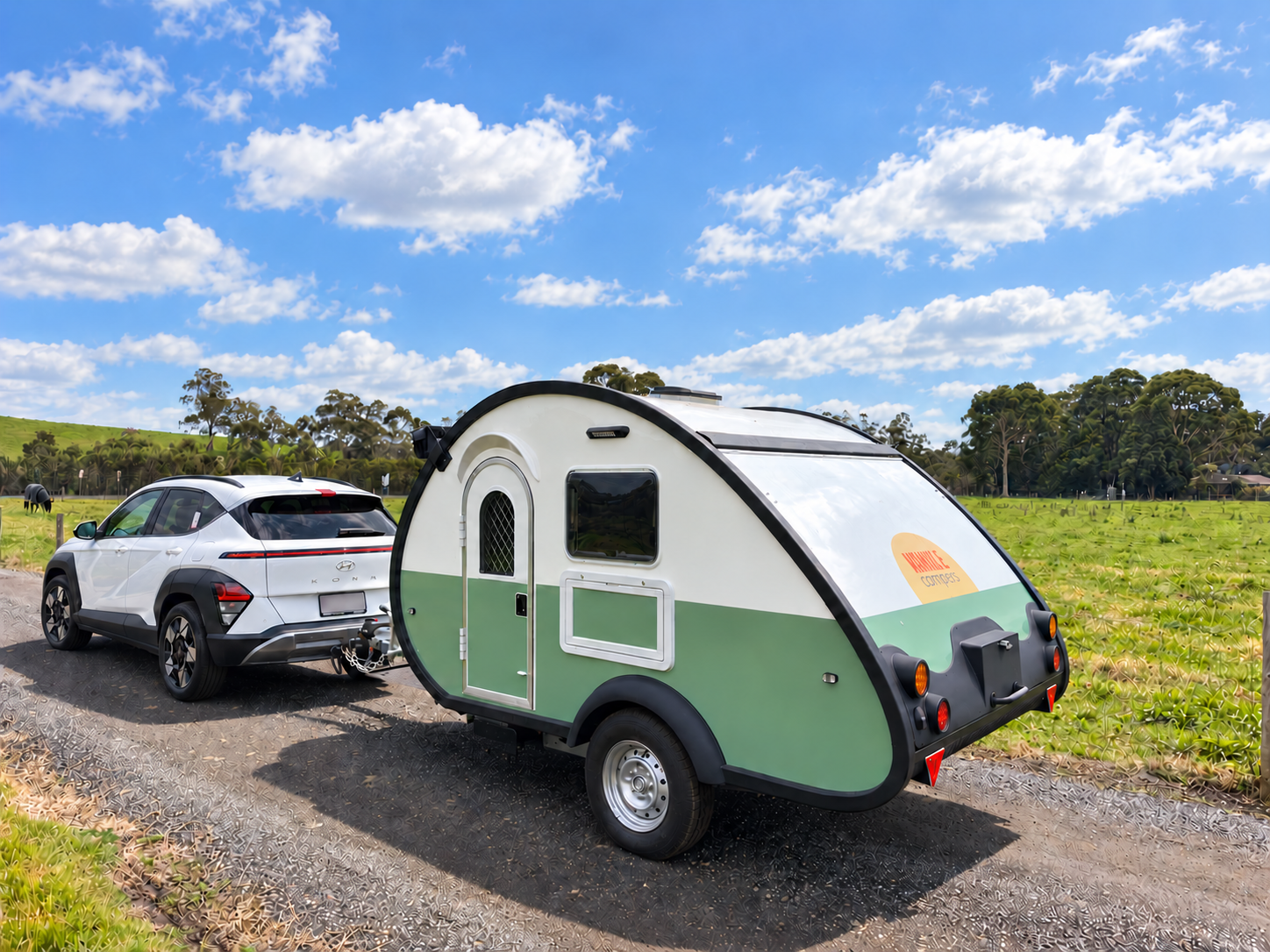 Nimble Camper hitched to a small SUV