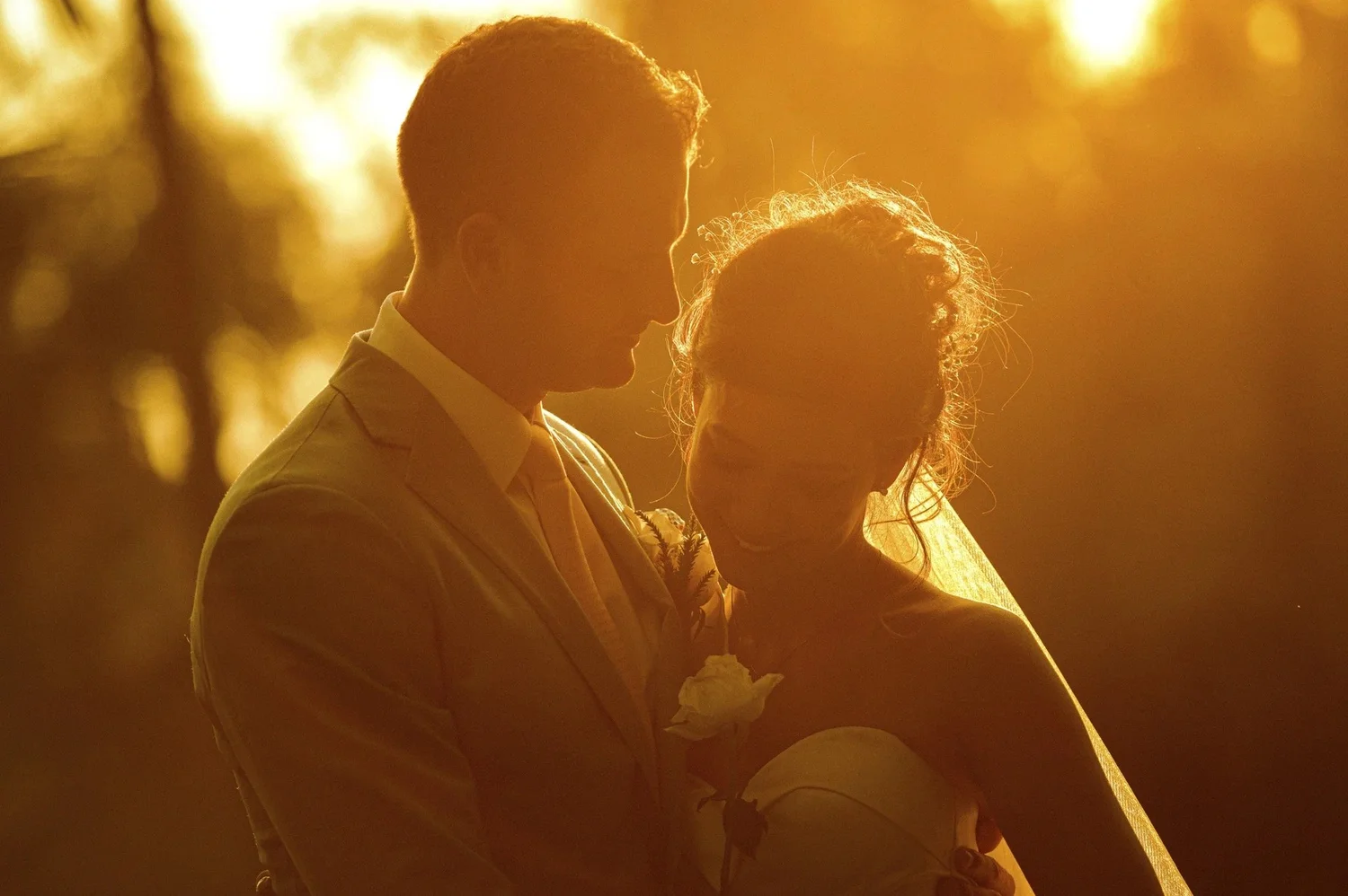 Adam and Celeste together in warm backlight