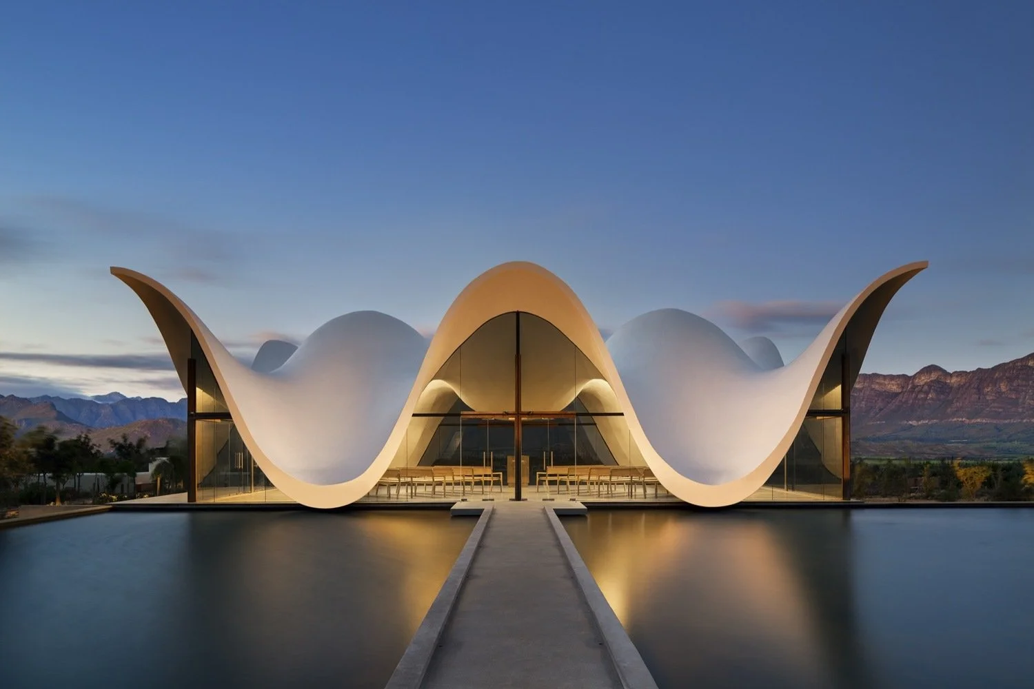 Sculptural architecture with sweeping curved forms reflecting inspiration through shape, movement, and design.