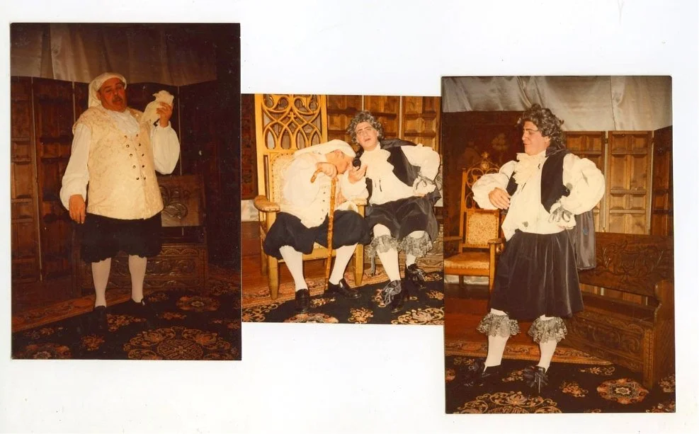 Three people in 17th-century European costumes performing on stage in a vintage-style room.