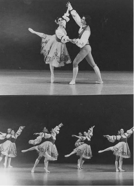 Classical ballet performance with dancers in traditional costumes on stage.