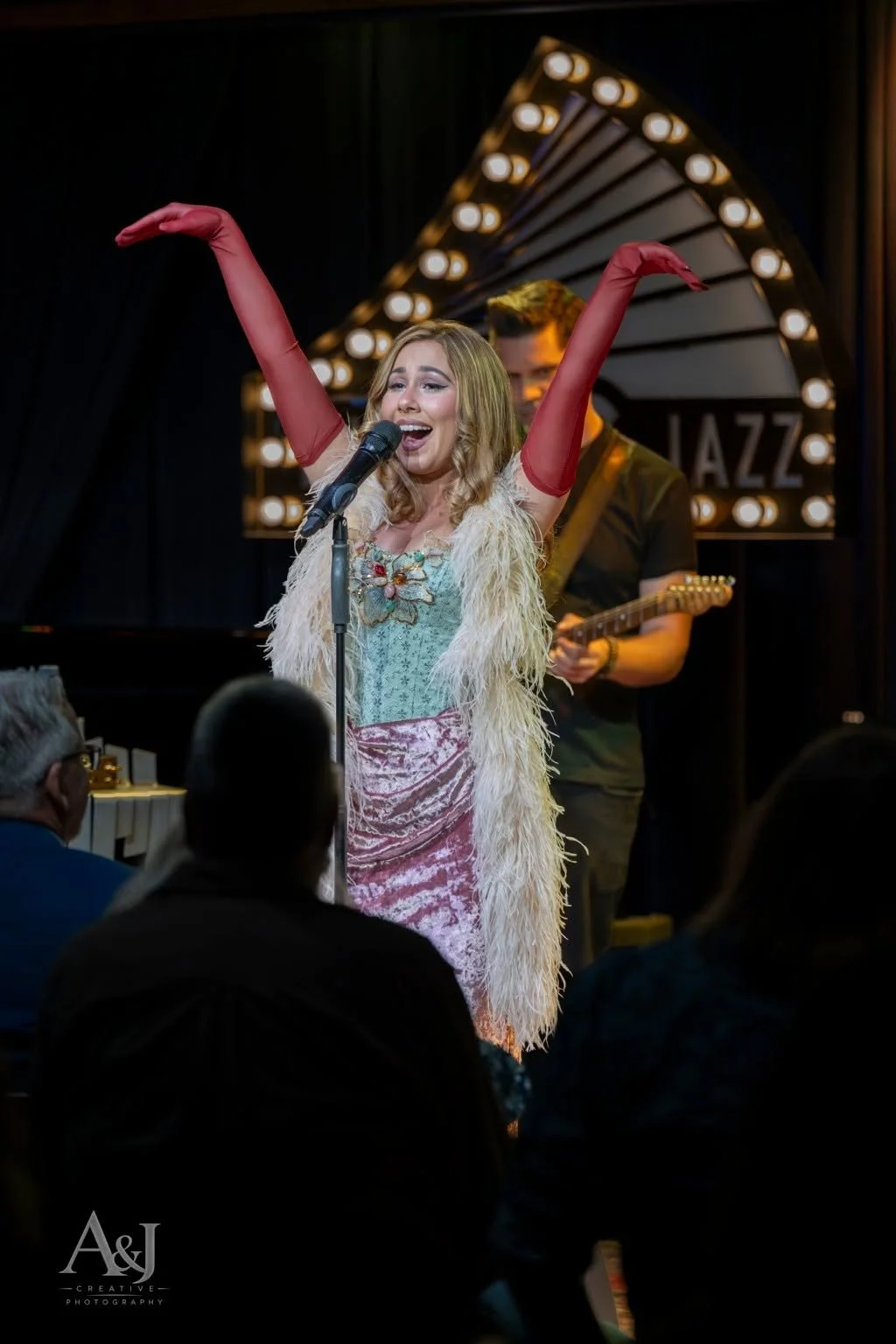 Haley Reinhart performs beneath the illuminated Middle C Jazz sign in Charlotte.